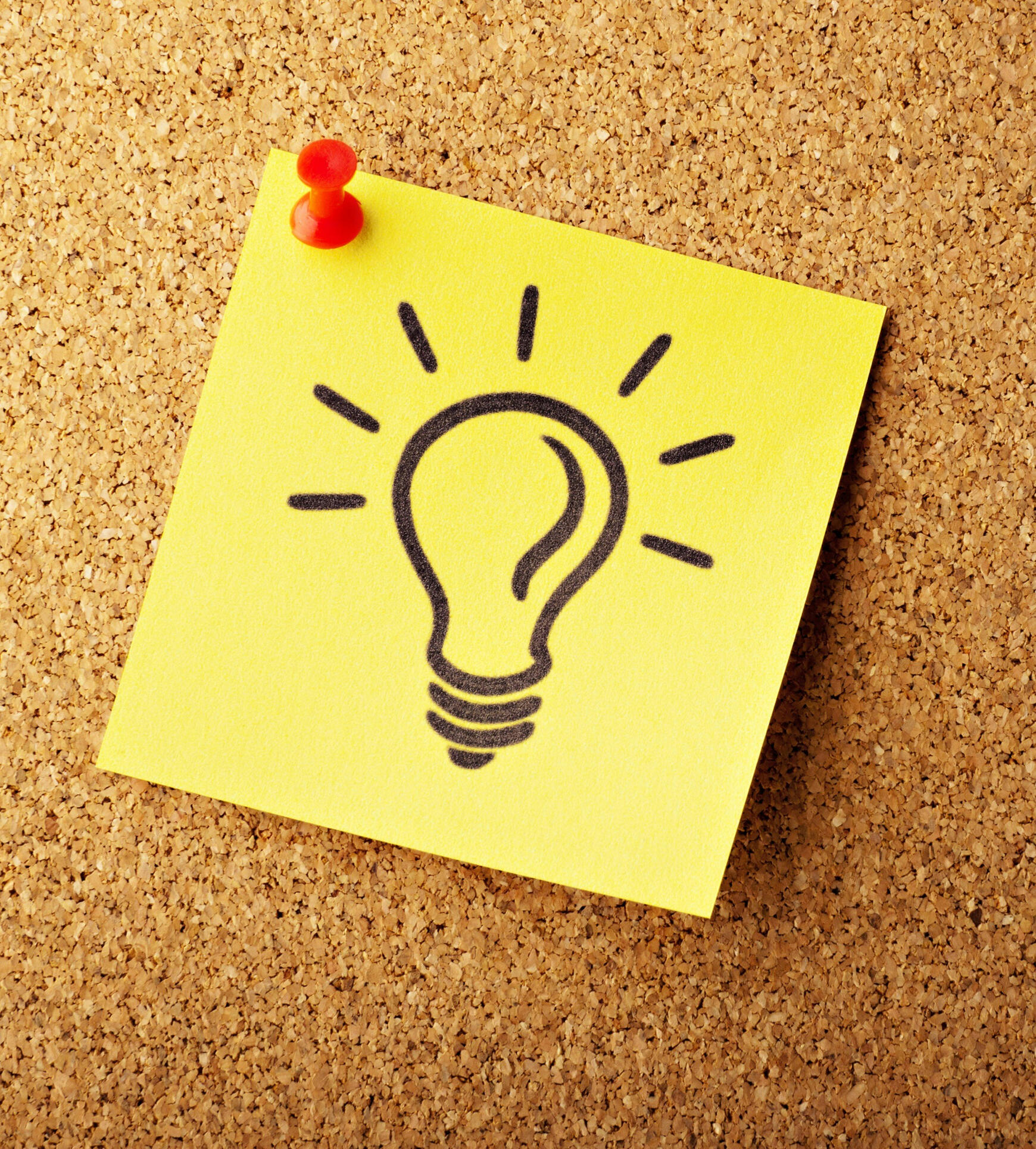 Photo by AbsolutVision on Unsplash Lightbulb drawn on a sticky note and pinned to a corkboard